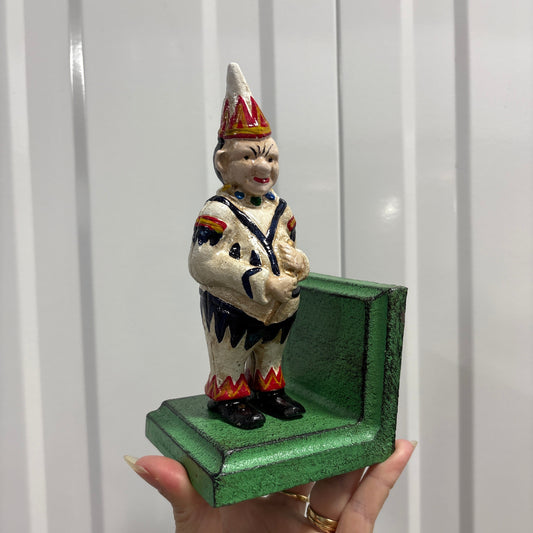 Creepy clown cast iron bookend