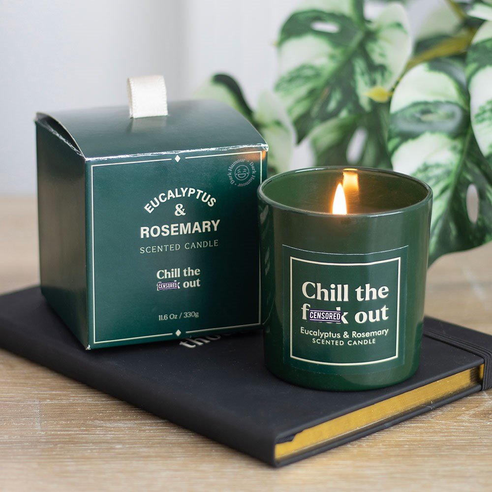 Green scented candle with 'Eucalyptus & Rosemary' and chill the fuck out label.