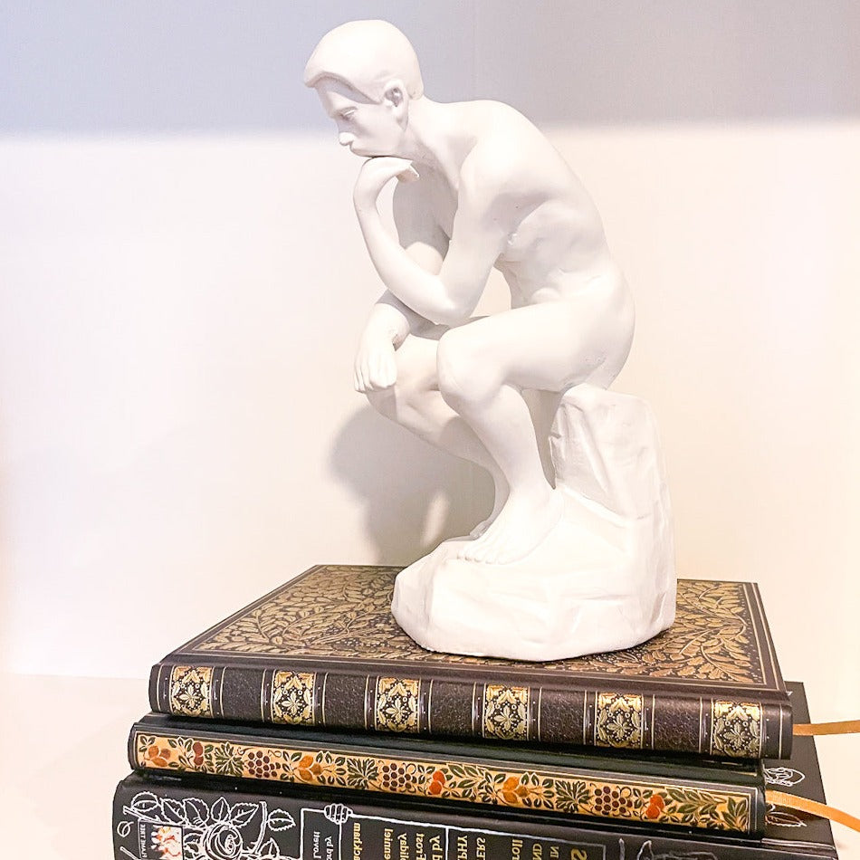 The thinker man bookend statue