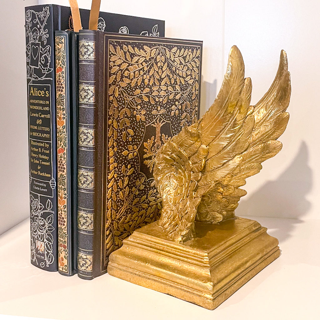 Majestic gold wings bookend statue