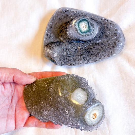 Polished edge amethyst with stalactite eye crystal cluster