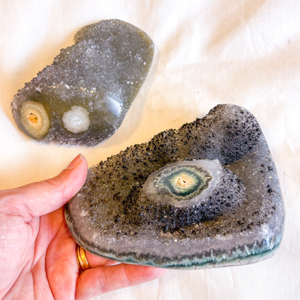 Polished edge amethyst with stalactite eye crystal cluster