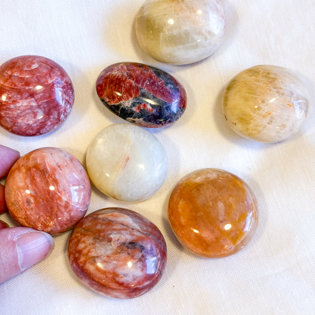 Red Alkali Feldspar crystal polished palm stone