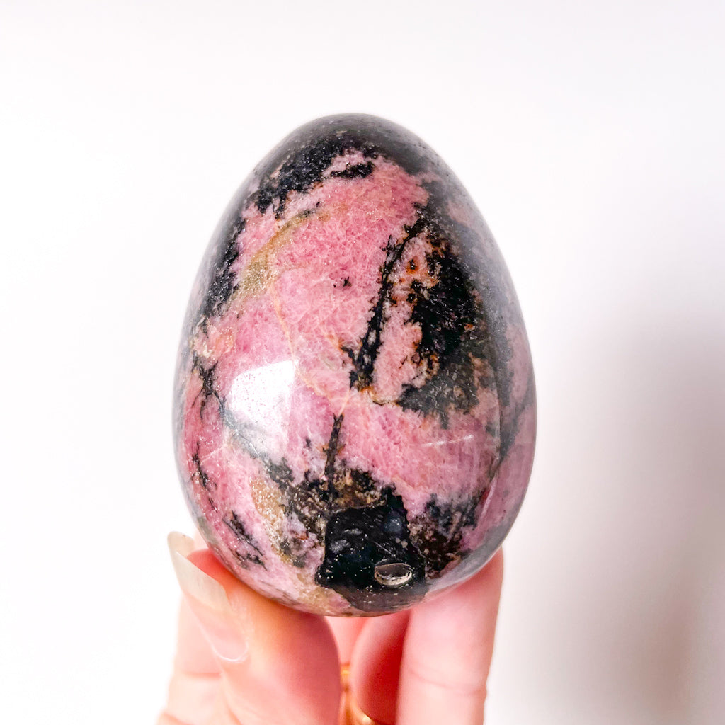 Pink rhodonite crystal egg