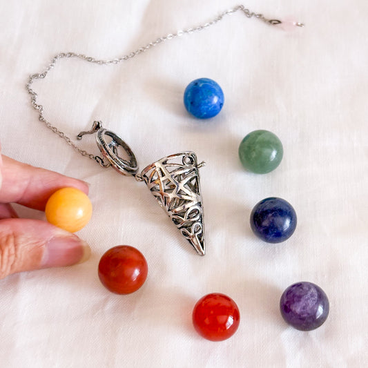 Pentagram pendulum with 7 chakra crystals