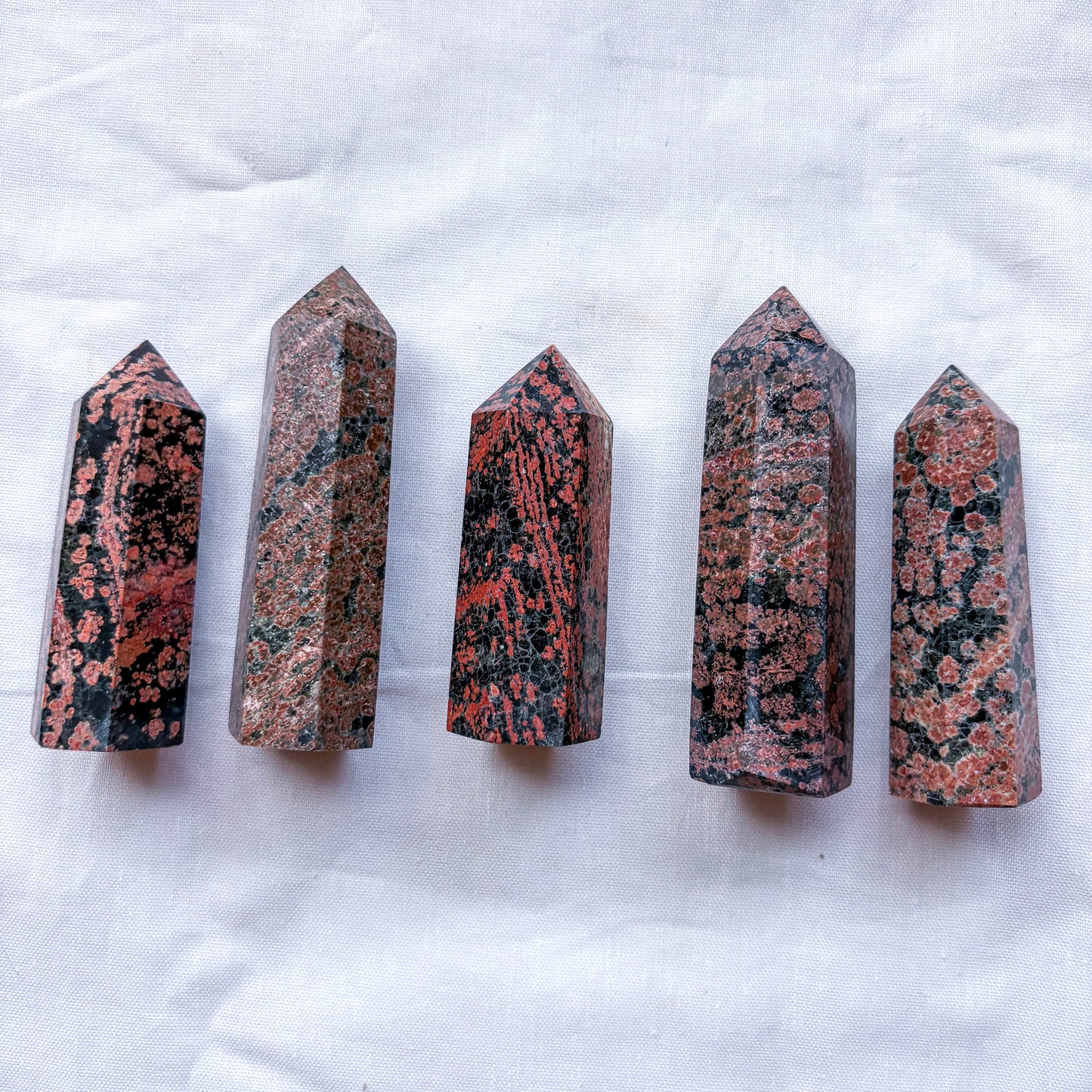 Red snowflake obsidian crystal tower