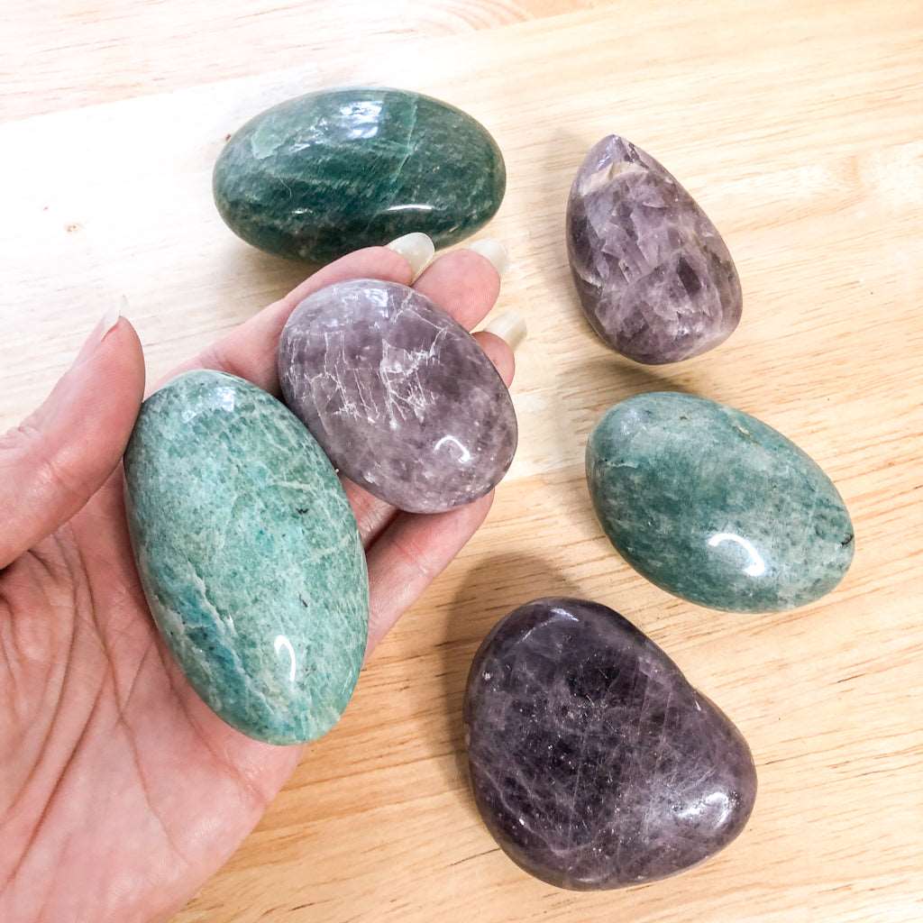 Aqua amazonite or purple anhydrite crystal palm stone