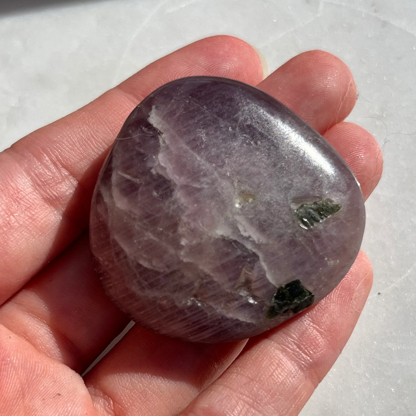 Rare purple anhydrite crystal palm stone