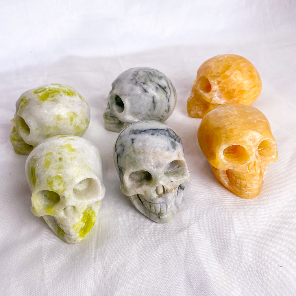 Crystal hand carved skull statue L - calcite or serpentine