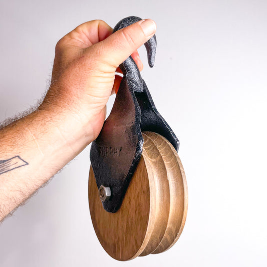 Vintage cast iron and wood pulley with hook