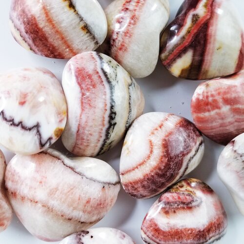Medium pink banded calcite puffy heart shaped crystal