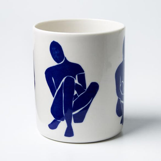 Navy & white sitting around planter pot