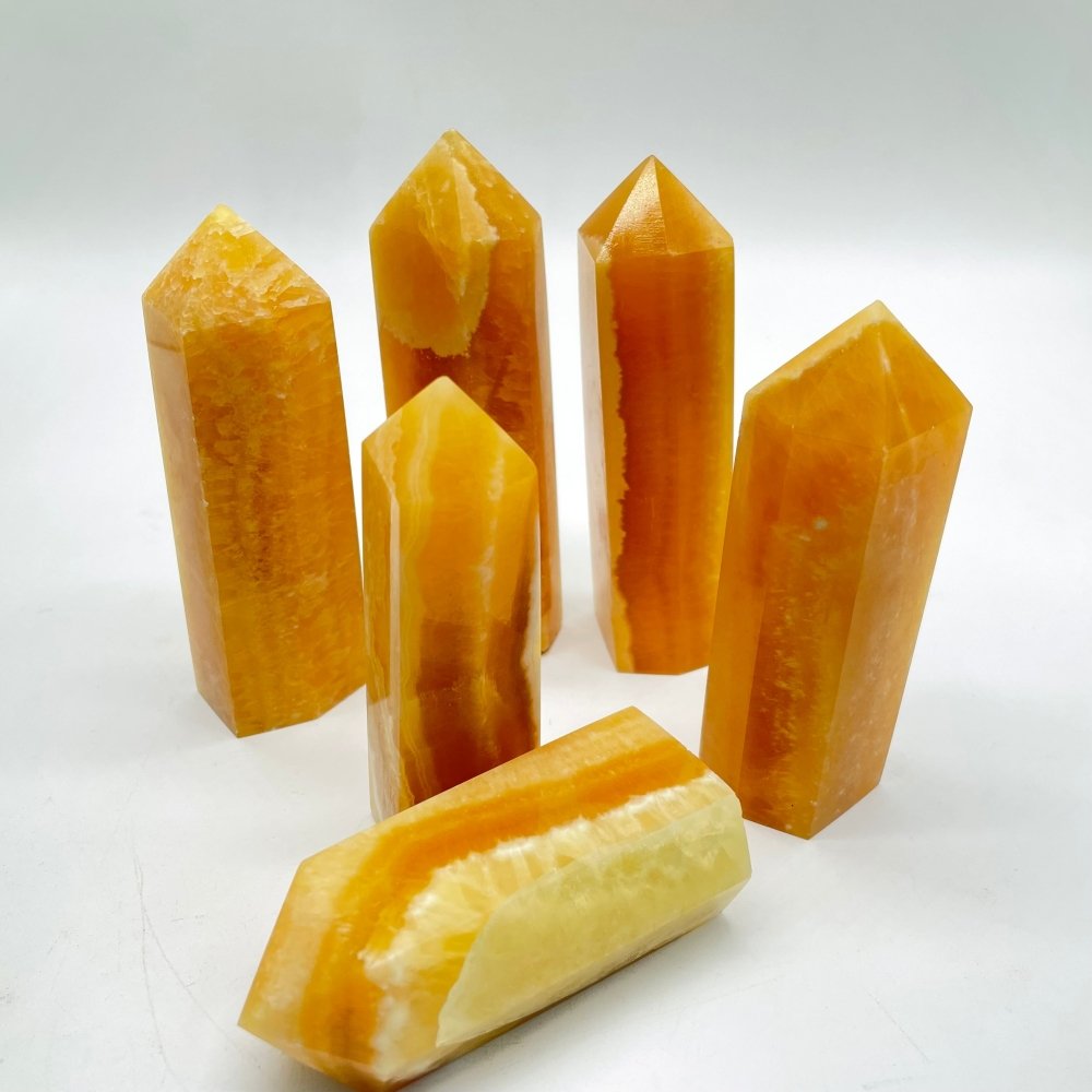 Orange honey calcite crystal tower