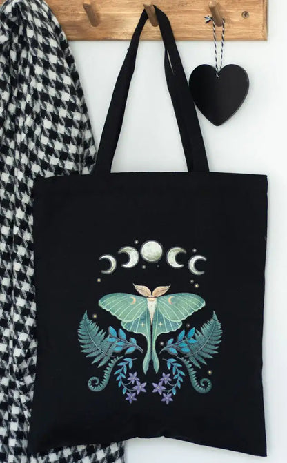 Moon phases moth tote bag
