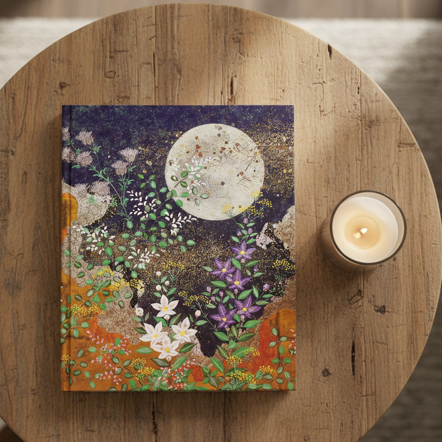 Decorative book cover with floral design and moon in night sky