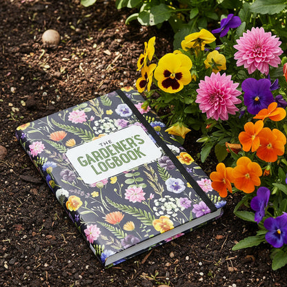 Floral notebook titled 'The Gardener's Logbook' on a dark background