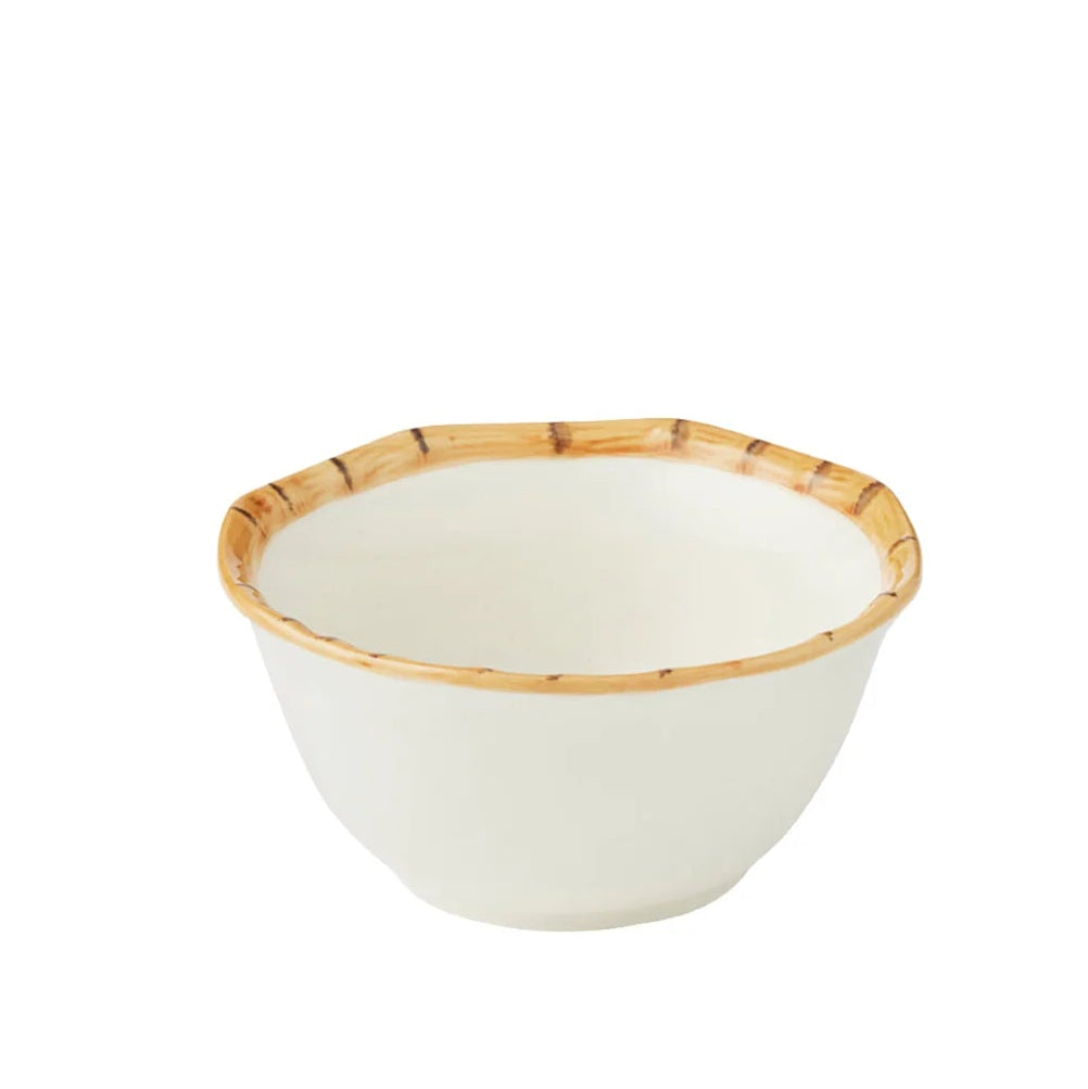 A small white ceramic bowl with a fluted rim and a bamboo painted pattern around the edge, shown against a plain white background.
