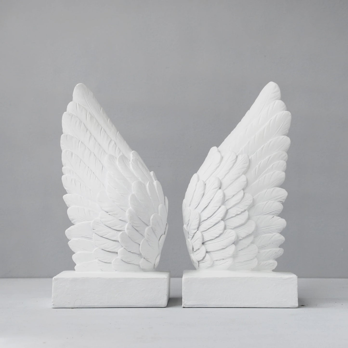 Angel wings bookends statue