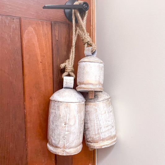 Vintage coastal white washed gold iron cow bell