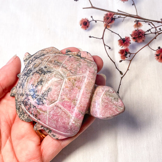 Pink rhodonite crystal turtle statue