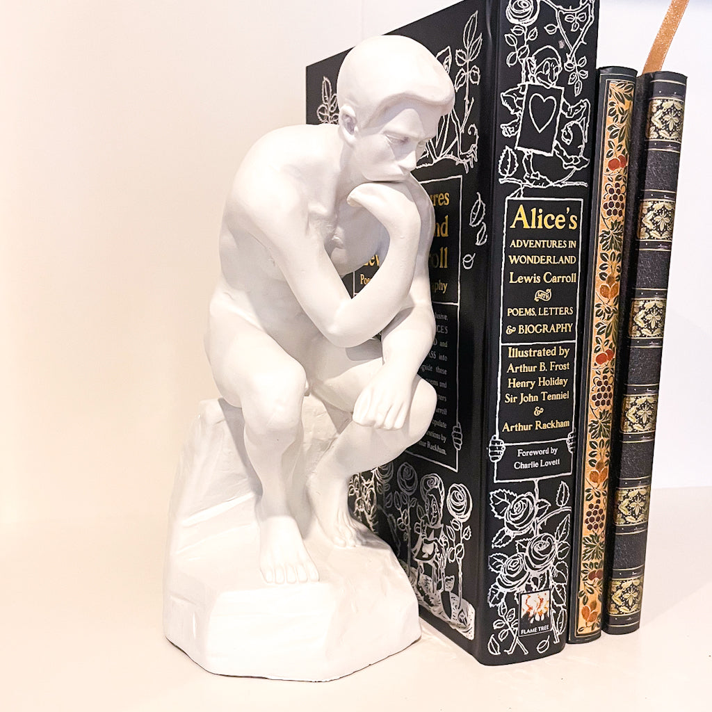 The thinker man bookend statue