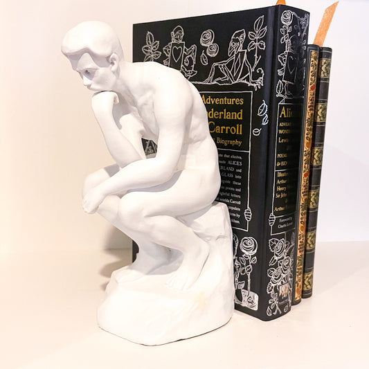The thinker man bookend statue