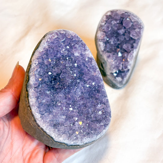 Polished edge amethyst crystal cluster