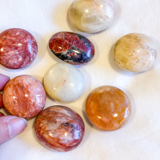 Red Alkali Feldspar crystal polished palm stone