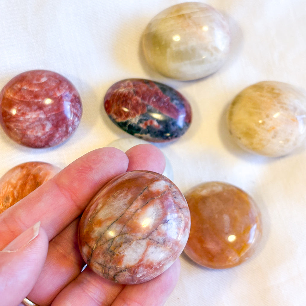 Red Alkali Feldspar crystal polished palm stone