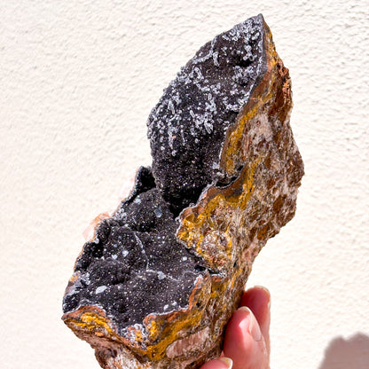 Manganese oxide, Rose quartz + Calcite crystal cluster on gold stand