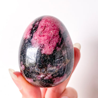 Pink rhodonite crystal egg