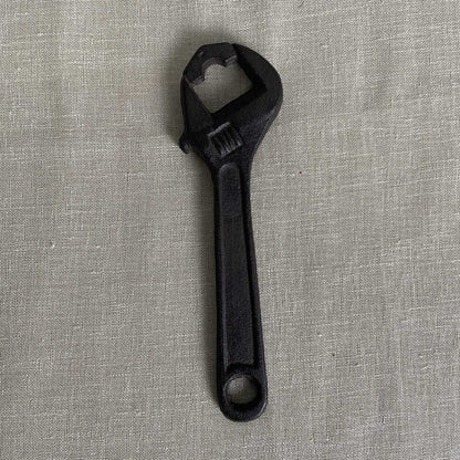 Cast iron bottle opener tool wrench