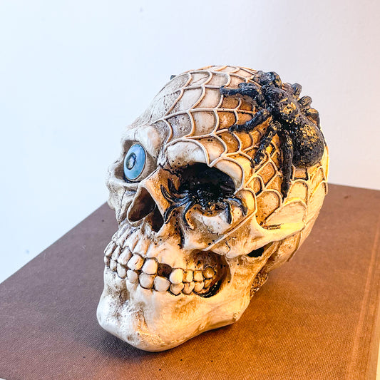 Spider eyeball skull statue