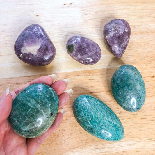 Aqua amazonite or purple anhydrite crystal palm stone