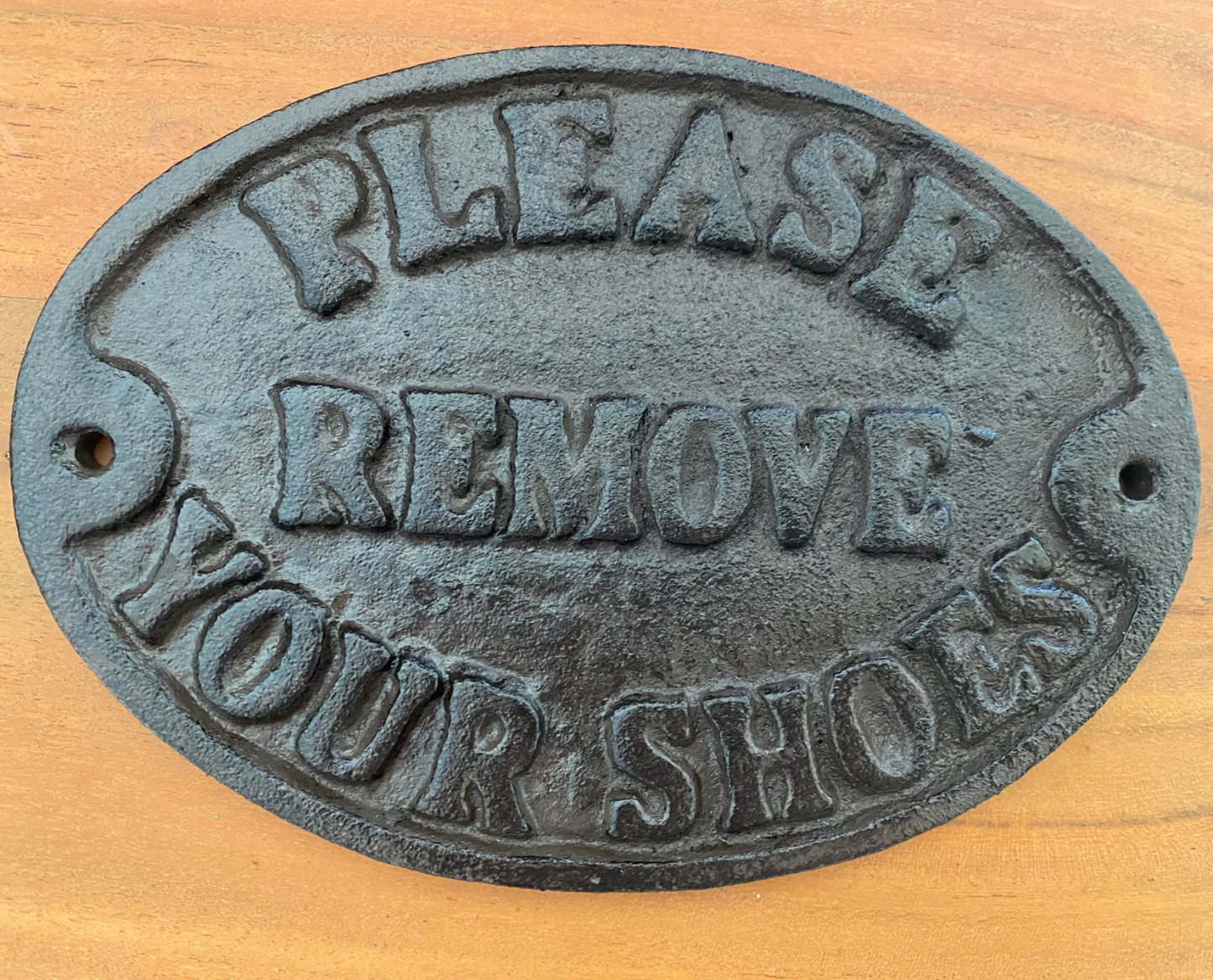 Please remove shoes cast iron sign