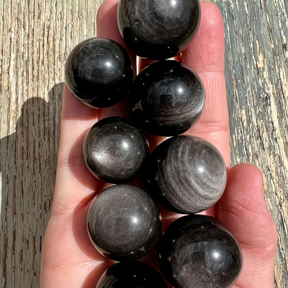 Silver sheen obsidian sphere