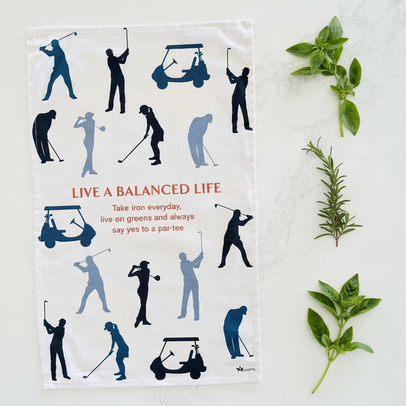Tea towel with golf-themed design and motivational quote on a white background