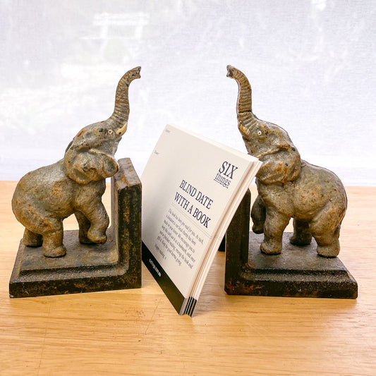 Vintage rusted elephant cast iron bookends pair