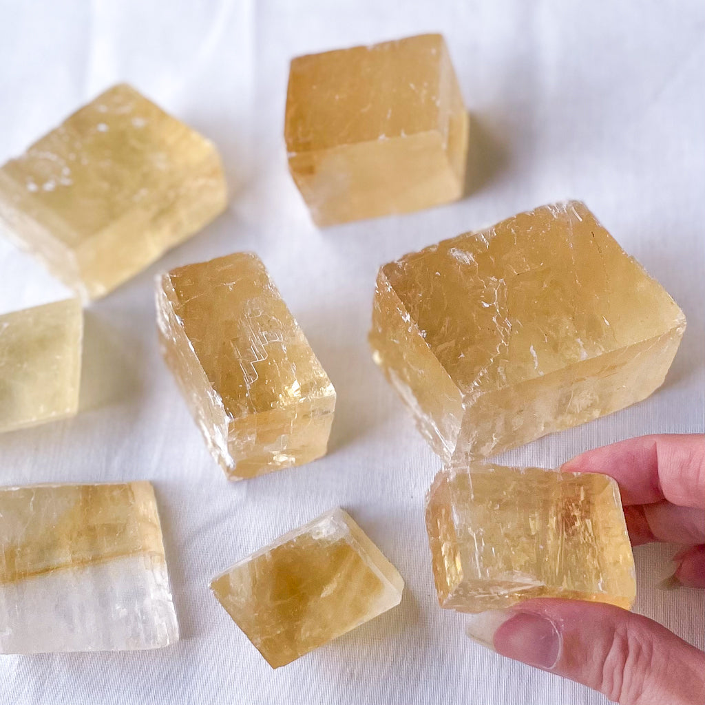 Optical calcite / honey calcite crystal rhomb / slice raw stone