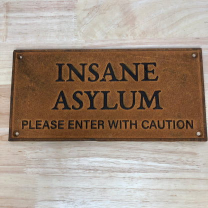 Insane asylum wall hanging rusty metal sign