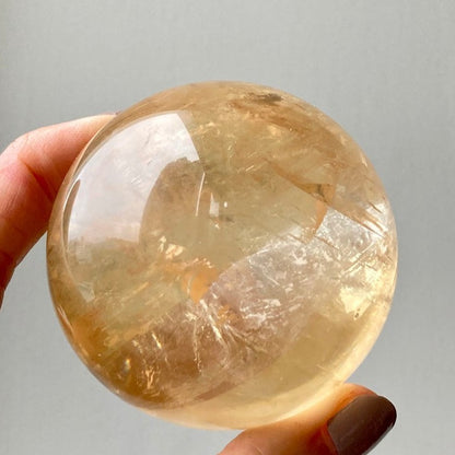 Honey calcite polished sphere crystal ball