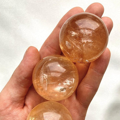 Honey calcite polished sphere crystal ball