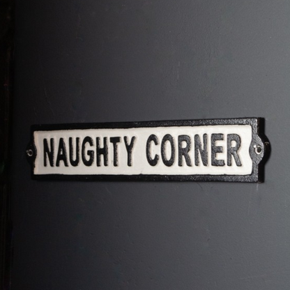 Naughty corner cast iron wall sign