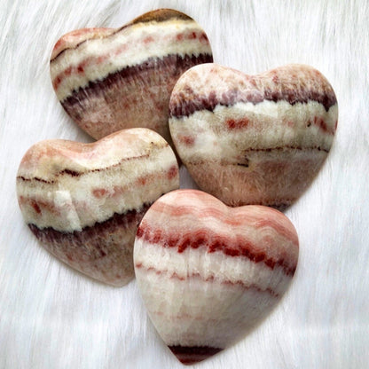 Medium pink banded calcite puffy heart shaped crystal